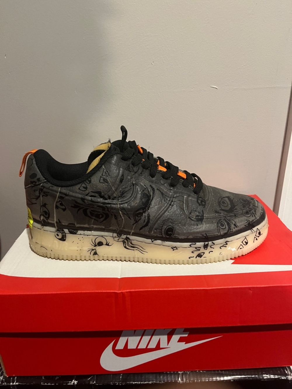 Nike Black Graphic Low-Top Sneakers with Ivory Sole and Orange Accents